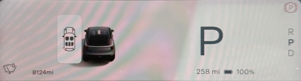 A small diagram of the car with a tiny red line where the charging flap is.